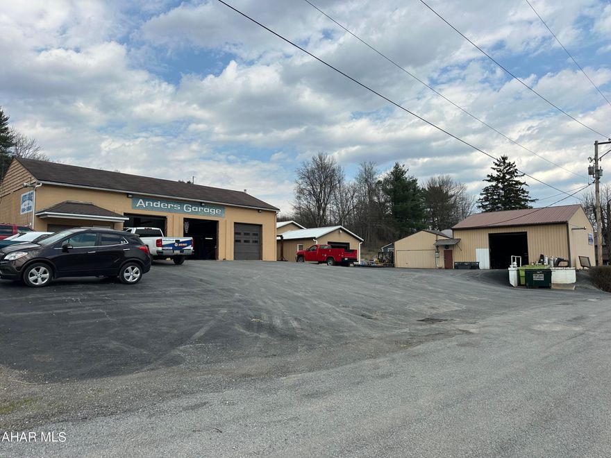 Chance to open your own garage or any other business that you need garage door assess. There is a loading dock just off the one building. 3 phase electrical, gas heat plus waste oil burner. Public water and sewer. Seller would be interested in selling machinery and tools but not part of this sale. Presently there is a garage, machine shop and paint booth, but buildings could be used for whatever you need. There are 3 buildings with overhead doors Building #1 3 (2) doors-10x10 1-7x9 Building #2 2doors 8x12 & 8x9 Building #3 1 door 12x12.