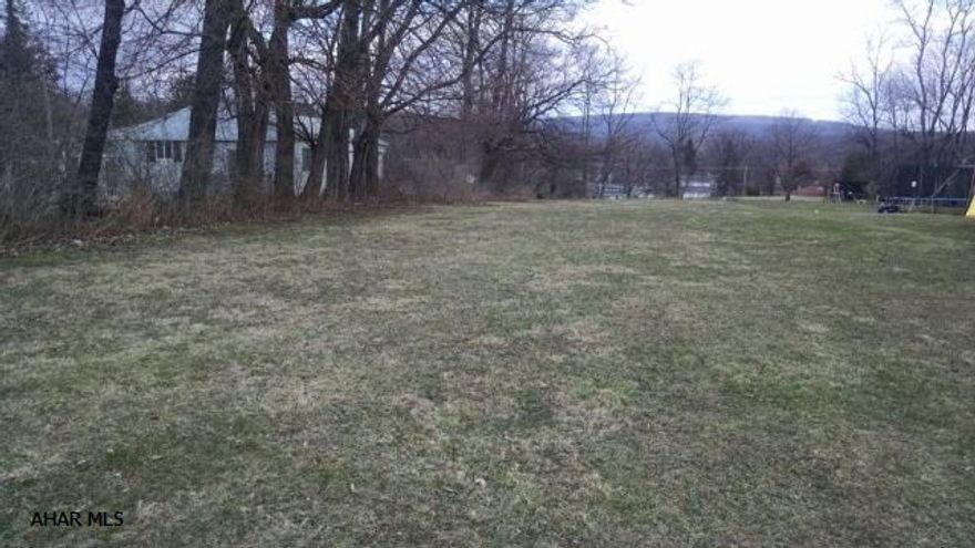 Flat 1/2 acre lot near Ebner school - water, sewer, electric and natural gas at street. Great location for new construction, mobile or modular - the choice is yours!