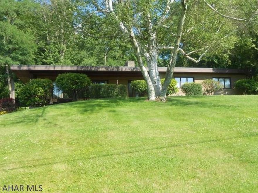 Unique style home custom built in 1959. This is one of the great parts of Bedford to raise your family or sit back and enjoy life. 3 bedrooms and 2 baths, family room with wood fireplace. An inviting sun porch. Living room is large with big windows to enjoy the natural light and outside views. 2 car integral garage. Close to golf course and school. Come take a look and see for yourself.