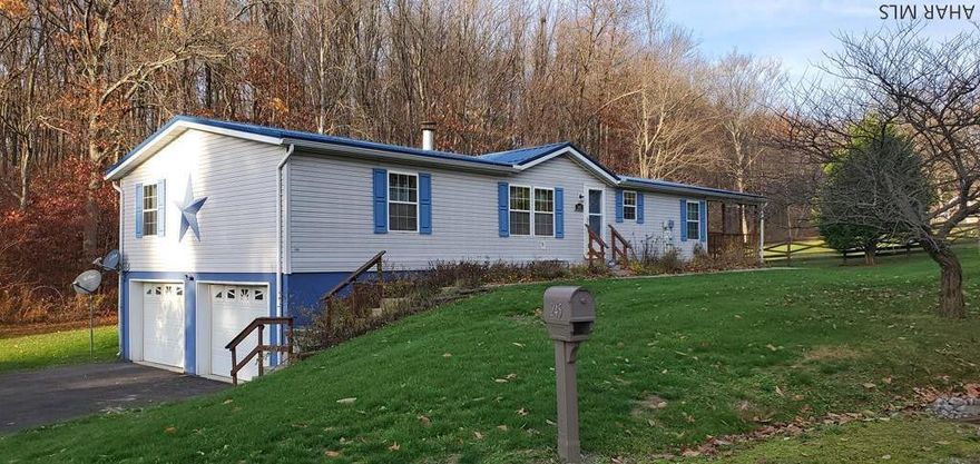 Exceptional 26x70 Doublewide with vaulted ceilings, 3 bedrooms, 2.5 baths, eat-in kitchen, 2 car garage, partially finished basement.  Master bedroom has full master bath, living room with stone fireplace, shed, covered porch, priced to sell!