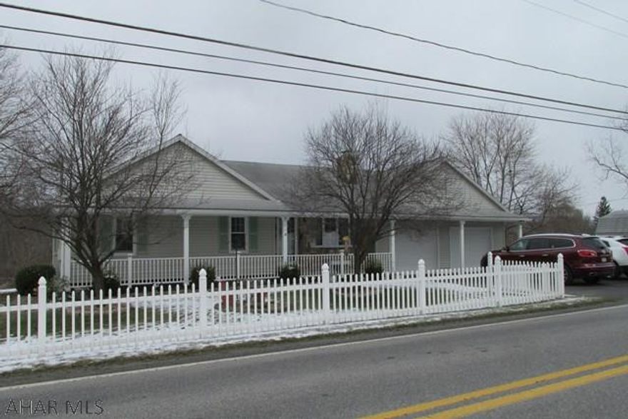 Beautifully maintained ranch home - lovely level lot and extra lot with water tap included. Totally maintenance free, new windows, vinyl sided, new carpet, 12 x 18 shed, wall air conditioner, updated appliances included. Home is all electric heat in ceiling and baseboard, monthly bills ($276.63). Newly remodeled bathroom, 2 propane heaters included (nice wall units), wood burning stove in Man Cave/bar area need a flue, old flue removed. Ceiling fans in all bedrooms. Basement entry from garage and kitchen. Walk up attic, knotty pine cabinets in kitchen with corian counters, screened porch with porch swing. On lot septic regularly pumped and checked, public water on both lots.