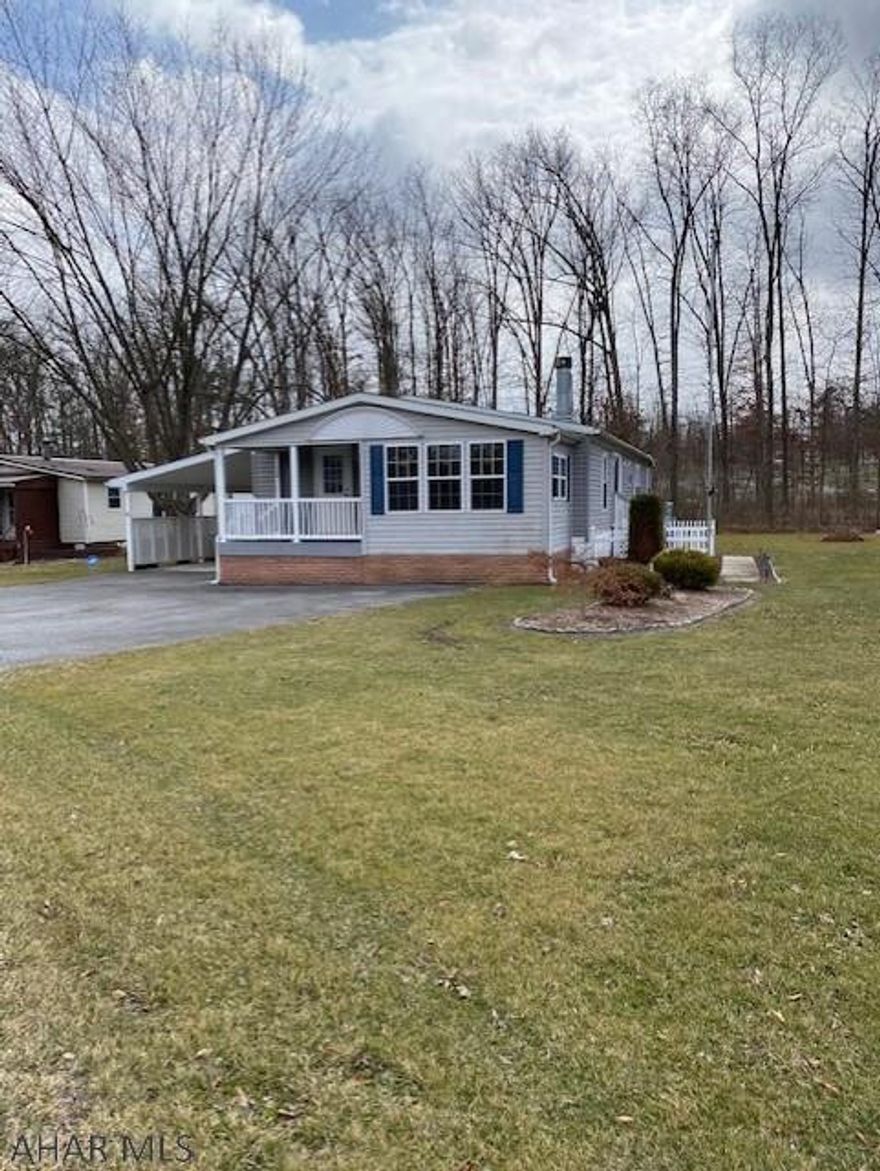 Well kept doublewide in Friendship Village. Three bedroom, 2 full bath with a finished enclosed porch, family room with fireplace, large master suite, nice kitchen with pantry cupboard and island. Central air, covered carport, and shed. Enjoy all that Friendship Village has to offer!