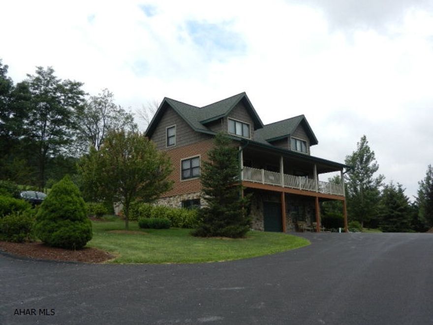 Rustic elegance in this 2 story lodge like, 4 BR/4 BA home situated on a 119 ac. adjoining Buchanan State Forest (13,000 ac). This spectacular home (open floor plan) includes a large, oak, eat-in kitchen, a spacious dining room/living room with hardwood floors and a stone fireplace with wood stove insert Sleep well in the spacious master suite w/ full bath and two large closets. A laundry/half bath complete the first floor. The second floor includes three large bedrooms w/ large closets,full bath and great views. The basement level includes a 2 car integral garage, den/office and 1/2 bath. A detached 4 car garage w/ outdoor furnace on site. Generator hook-up and internet-cell service.