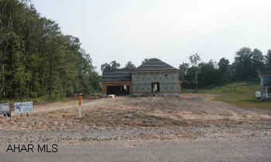 Formal 2 story brick and frame, Attached 2 car garage & bonus room above. Spec Home