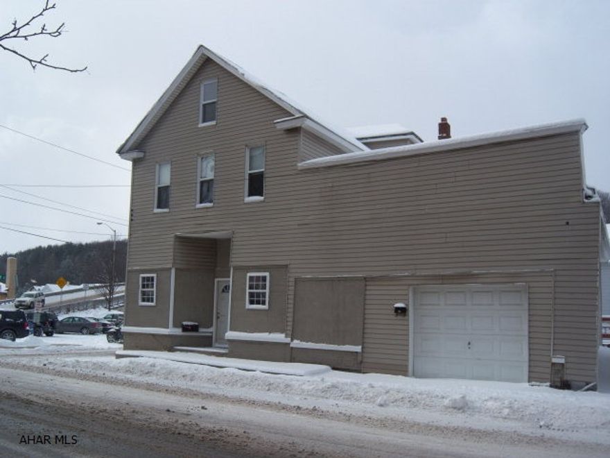 Great investment property! first floor has sufficient area for commercial use or renovate for apt. Second floor has spacious 3 bedroom apt. w/ nice big oak kitchen