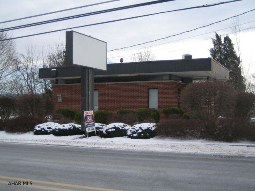 Commercial property in Warriors Mark. Former bank drive thru facility. Brick construction and paved parking area. Many possibilities.