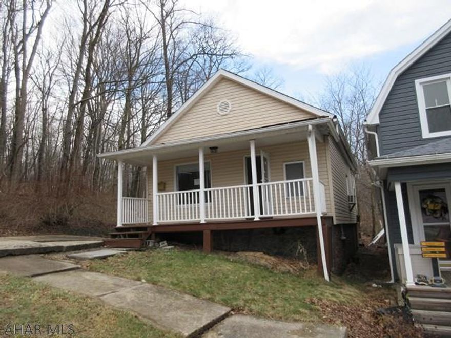 Toy Town vinyl 1 story home. Vinyl windows, fenced yard, relaxing front porch. Really nice area, but home needs some work. AS-IS sale. Seller will make no repairs.