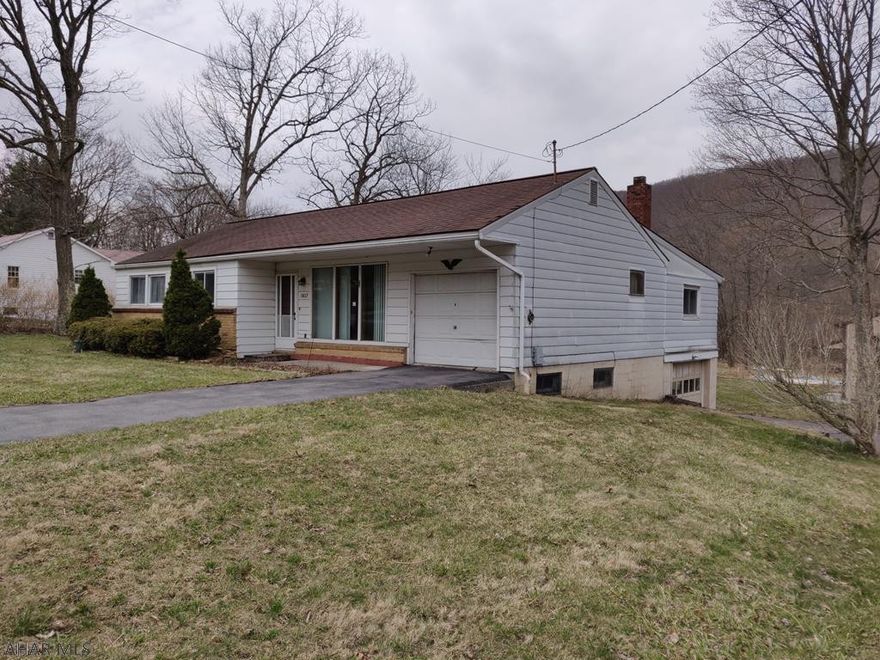 Great Fixer Upper on Nice Lot with the HUGE Garage of your Dreams. 3 BR 1 Bath with 2 Living rooms. 2 Attached Garages and a LARGE Detached Garage with Heat and Separate Electric. Excellent place to fix up or store cars. House needs a lot of work. Rehab Loan (FHA 203K) could work well. Agent Owned.