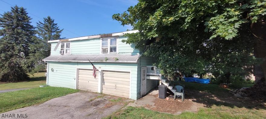 Nice corner lot in Spring Cove School District. The home above the garage is in need of repair or tear down. Use extreme caution.