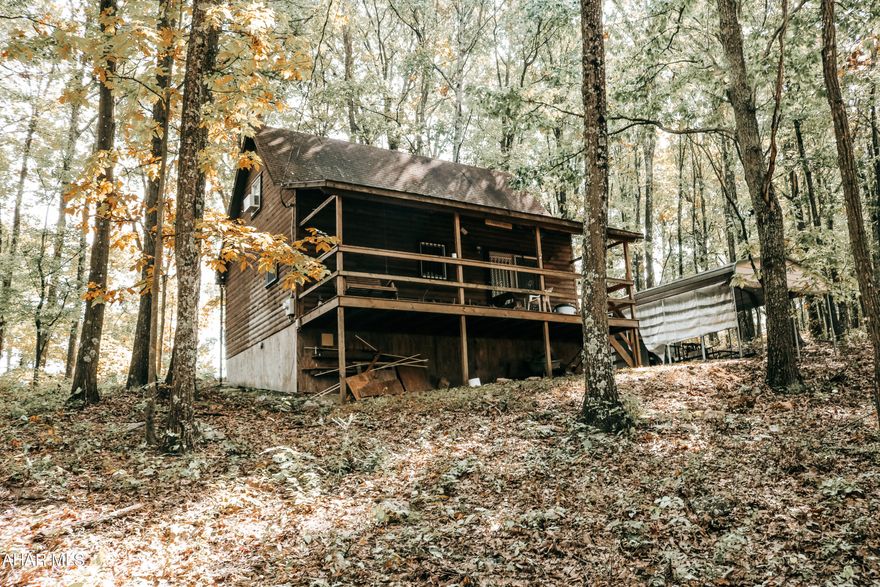 Your house hunting is over! Make this cozy, cabin your full-time residence or getaway!  Beautiful fully furnished home on over 7 acres of wooded land.  Enjoy the views from all parts of the property.  1 bedroom and 1 full bath on first floor.  Large kitchen and living area for gatherings.  Upstairs loft with bedroom and half bath.  Pellet stove in the living room.  Private well and private septic. Carport included to park under and enjoy the outdoors. Be sure to relax at the fire pit.   Just in time for hunting season!