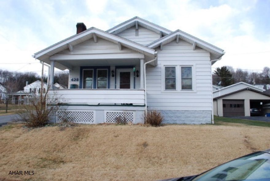 1 Story 2 bedroom home with a 1 car garage. Has a covered front porch and a covered rear patio. The fireplace is wood and has not been used for some time the chimney is caped off.
