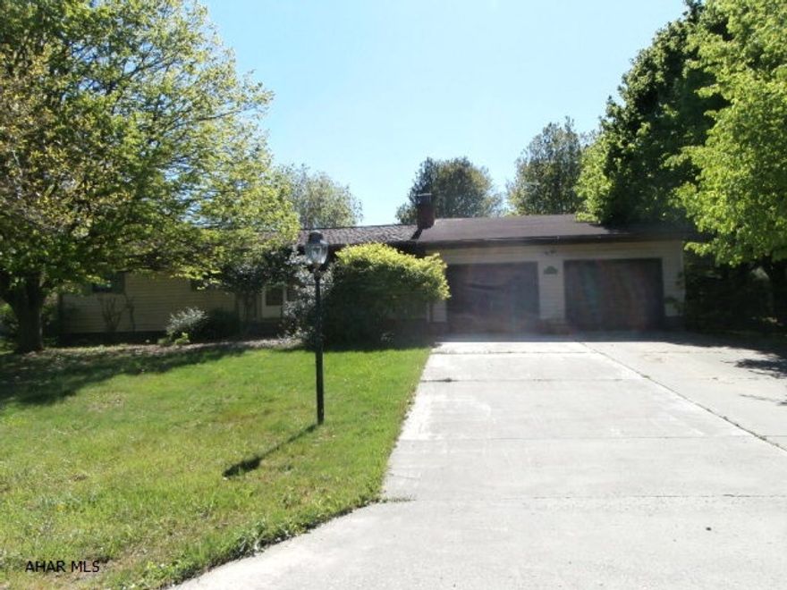 Bank REO property - sold strictly in AS IS Condition. Great opportunity for the handy person - large kitchen and dining room, Living room with fireplace, finished basement including cedar room, family room with bar. Attached two car garage. Needs tlc and roof needs replaced now.