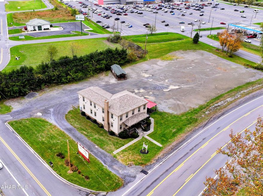 Outstanding investment opportunity along Route 93 / New Creek Highway — right next to the Walmart Supercenter! This property features a 4-unit apartment building situated on 1.5 acres of level land with excellent road frontage and visibility. Currently producing steady rental income, the site also holds exceptional commercial or business development potential thanks to its high-traffic location, two off-street entrances to the property, and direct access to one of the area's busiest corridors.

Whether you're looking to expand your rental portfolio, develop retail or office space, or establish a new business, this property offers the perfect blend of income, location, and future growth potential. Utilities on site. Strong visibility, easy access, and endless possibilities.
