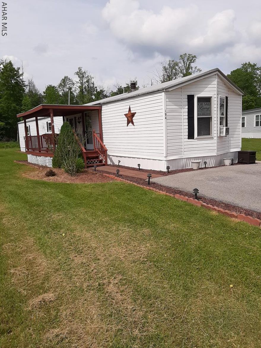 Well landscaped beautiful 2 bedroom 2 full bath mobile home with 2 parking spaces.  Lovely garden tub.  Eat in kitchen make this a warm welcoming place to call your next home.