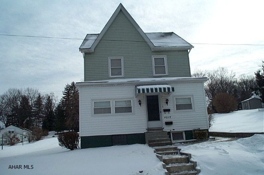 Two-story vinyl sided three bedroom home situated on 100 x 120 lot.  Small third bedroom leads to attic.  Eat-in kitchen.  Front and rear enclosed porches.  Toilet and shower in basement.  Hot water heat.  50' side lot.