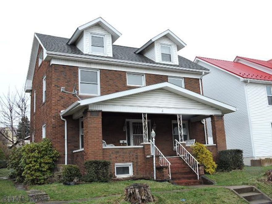 big brick on nice fenced lot.  Mud room off kitchen opens to deck and back yard.  Big 2 car garage with additional off street parking.  Hardwood and ceramic tile floors throughout.