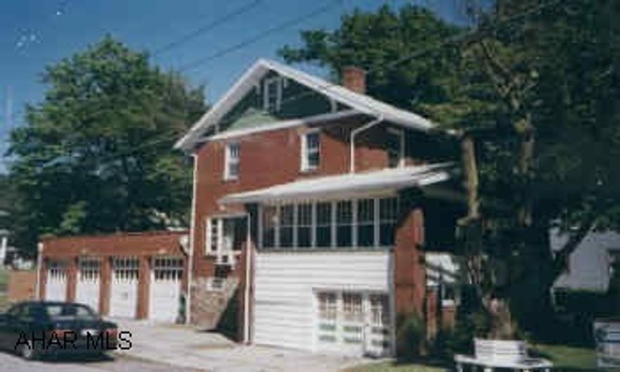 PLEASANT VALLEY BRICK THREE BEDROOM WITH 4 CAR GARAGE.