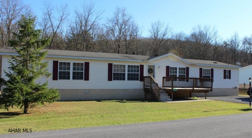Very nice double wide with front and side decks on rented lot in Pinewood Acres. Steam cleaned carpets, new wood grain laminate flooring in kitchen and laundry! Some new insulation underneath.Master suite has 2 bathrooms and spacious walk-in closet. Kitchen has plenty of cabinets, island, and eat-in area. Large level yard. Off street parking on paved driveway. 8 x 10 shed included.
