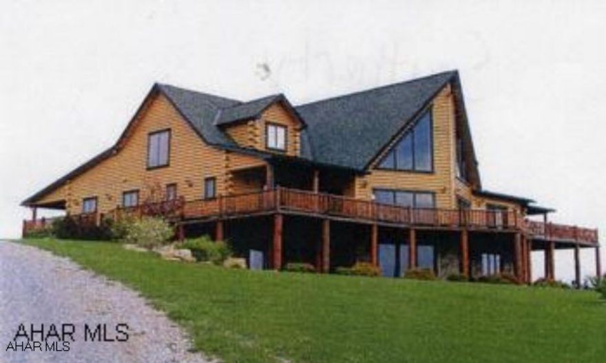Large rustic log home, built in 2005, containing 3886 SF finished area on 533 acres. Home is fabulous, one of a kind! Custom throughout! Detached garage with inlaw apartment. Acreage is fenced, wooded with various food plots. Deer, bear, turkey etc. Adjoins State Game Lands. Very private setting with exceptional views. Call for more info - too much to list!