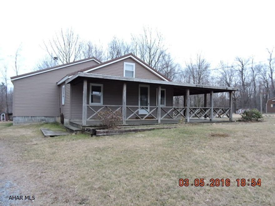 Terrific location and nice lot compliment this 1 1/2 story home.  3BR & bath on 1st floor. Modern kitchen.  Sit on the wrap around porch & enjoy the quiet country.  No heat on 2nd floor to bedroom or bath.  As Is Sale.  Wood burner in basement is not useable.