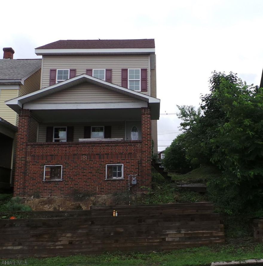 Outside is complete.  Interior is down to studs with 1st floor open floor plan and 2nd floor down to studs for each room.  3rd floor has space for 1 large room and bath.  Sold "AS IS" - no utilities on.  Off street parking in back.
