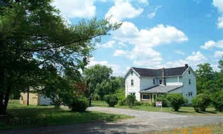 Old Farm House on 17 acres- 2 BR with newer furnace and elect service.