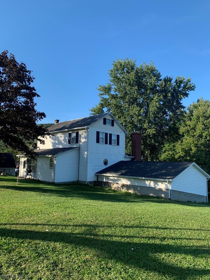 Two-story farmhouse on 10 acre Farmette with structurally sound barn, chicken coop, and detached two car garage. Located in Berlin brothers school District. Last property in new Baltimore that is allowed cattle. Move in ready with beautiful views!