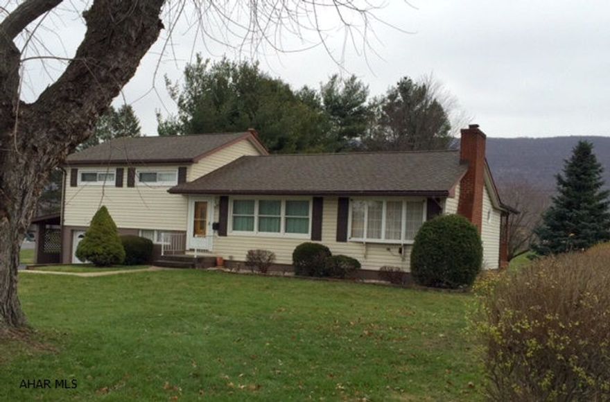 GREAT LOCATION on a beautiful lot, in the Bellwood School District! This home is great for out door entertainment! It has lots of covered deck space and a covered pavilion, and also a covered patio with a huge back yard. Nice kitchen with cherry cabinetry and laminate flooring. Large living room with lots of natural light and gas fireplace. This home has good bones with good mechanics. One car garage and also a carport. Ready to move into!! This property sits on a 100 x 220 IRR lot plus it also has and additional 50 x 200 IRR lot. Qualified buyer only, Seller is firm on listing price.