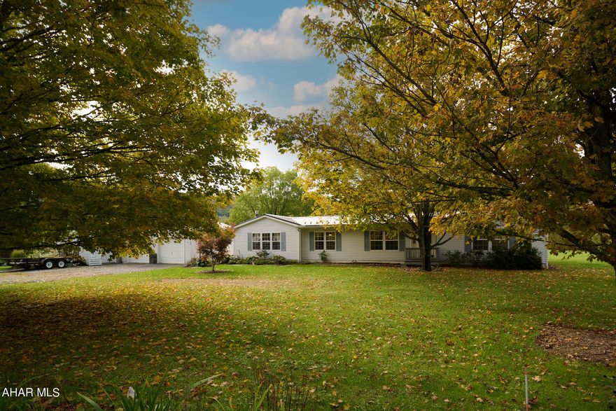 Attractive and well maintained one floor living home in a pastoral setting!  Resting on nearly 1.5 acres, this charming home features an open kitchen and family room area with vaulted ceilings, island, skylights, and under cabinet lighting in the kitchen , fireplace, and a full owners suite. The home also has a new metal roof. The detached workshop is a home worker's dream.  Enjoy celebrating in the spacious kitchen, living and dining areas.  Relax under the gazebo with a view of your back yard on a peaceful evening.  All of this within short distance to I99, 30 minutes either way to State College or Altoona!