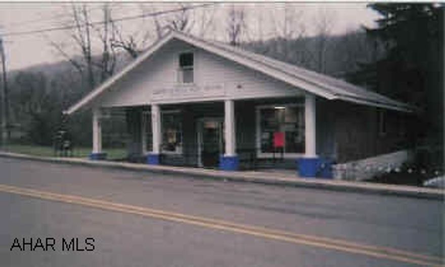 Front is Post Office with Lobby, office, utility room and 1/2 bath, back is an appartment. Located in Six Mile Run