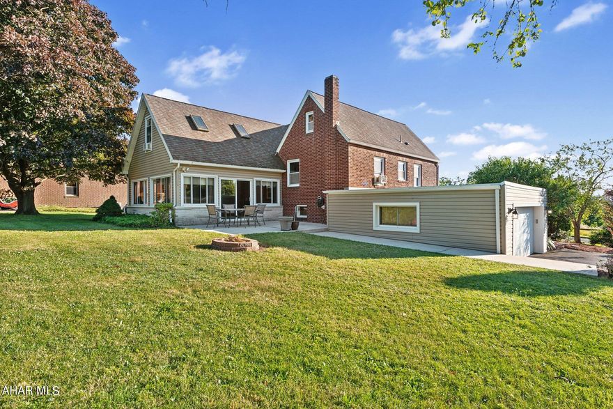 Schedule a tour to see this unique home with a gourmet kitchen with center island and heated floors. This 2+ bedroom home has space to explore! The main bathroom is large with a Ceramic tile shower, heated floors and a large walk-in closet. The primary bedroom has a bonus room attached & attic storage. On the lower level the family room with a dry bar awaits. A mud room with a 1/2 bath & closet -- accessed by one of the front doors and the garage. The patio and large yard with a fire pit, 2 sheds & apple trees create a relaxing outdoor space. 
The gas fireplace is a focal point in the Living room.  An attached 2 car garage and paved driveway add to the perks of this home and property. --Sq footage and acreage are approximate