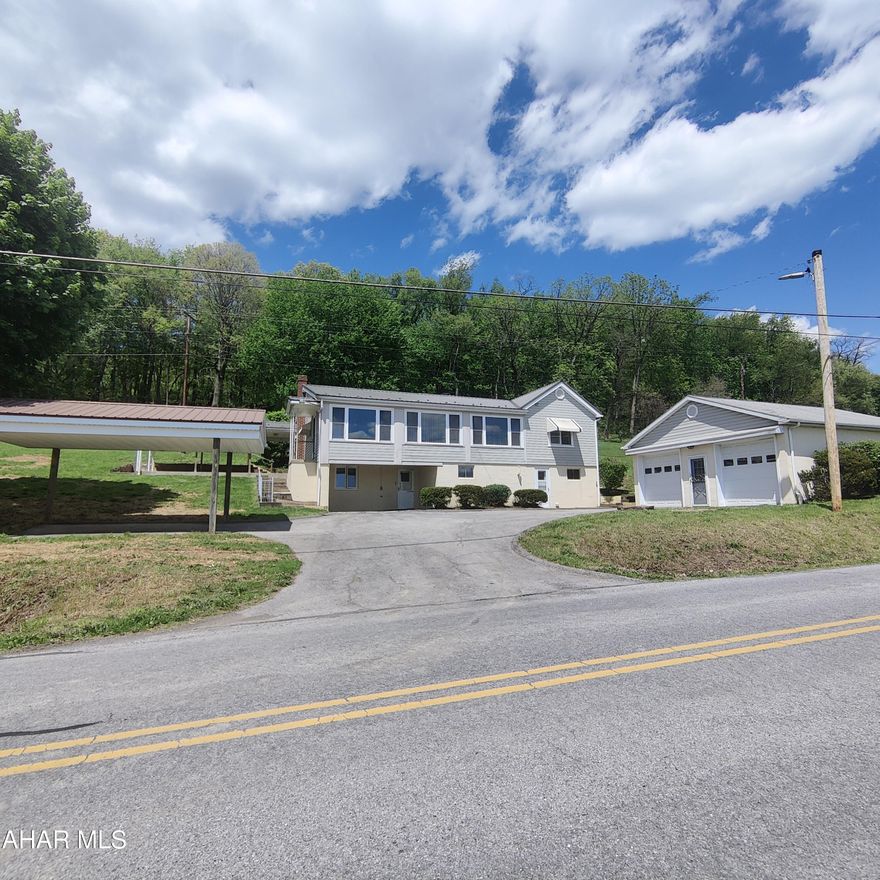 Sweet Spot on Lock Mountain Road with GREAT VIEWS of Martinsburg. Nice Home with 3 BR, 2 Baths, and 2 Car Detached Garage. The 1.5 Acre Lot provides a Nice Place for a Garden or Fruit Trees and a Covered Cement Deck for Eating and Entertaining. Consider the Roomy 2 Car Garage, Car Port, Wood/Coal Stove in Basement for Supplementary Heat, Many Closets, Walkout Basement to the Driveway, Enclosed Back Porch, New Metal Roof on House, Spring Cove School District... And Did I Mention the Views!