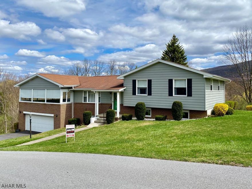 Large, multi-level home in Logan Townshipt. This home features 4 bedrooms, 2 and 1/2 baths, a beautiful modern kitchen that is open to the dining room, and 2 living rooms. There is a large bonus room on the lower level for a game room or large home gym. Four car garage is 39x22.5 and has storage off to the side. The covered porch is 40x22 and extends to the composite deck. Great home for entertaining!!