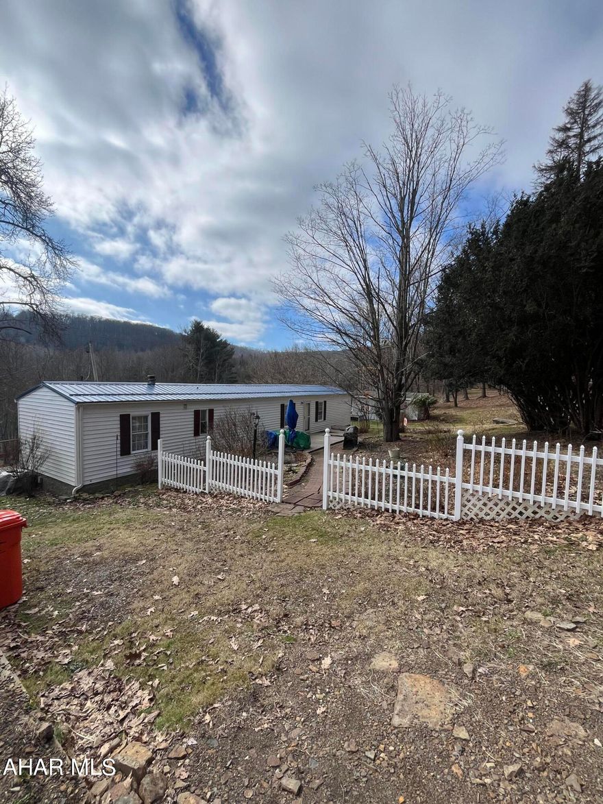 This 20 acre parcel offers privacy & opportunity for a great get-away as a hunting camp. Tons of wildlife and a large fresh water fed pond. Possible timber value and a gas well on the property so you have free heat! Mobile home is a 1994 and very clean - windows and roof have been replaced. There are 2 sheds on property and a spring house. Seller is older and will make no repairs. Seller must secure suitable housing.