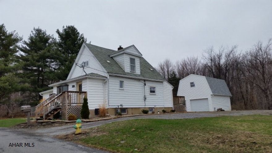 Beautiful country setting in the city. Remodeled 3 bedroom, 2 1/2 bath home with new large detached garage on a corner lot, 3 parcels (100 x 120), (100 x 120), (50 x 120). New kitchen, baths, wiring, carpet, decks, fence and electric garage door.   #J-283