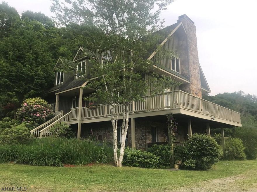 Presenting Cherrywood Estates, Enjoy the views and quiet country setting in this lovely architect designed contemporary home w/5 bedrooms & 4 baths. beautifully landscaped home. Enter property on private lane with concrete bridge crossing Town creek which is great for fishing. However the house and buildings are not in a flood zone. This home has solid cherry floors, wrap around deck, gutterless roof, stone fireplace, two wood stoves with stone facing, large rooms, full finished basement with more than 3/4 being above ground with bedroom and bath. 2 car oversized garage with additional space above that could be finished for additional living area. Garden and storage shed. All this in a private setting approx 3 miles from Interstate 68. Close to State game lands and 15 min. to Rocky Gap.