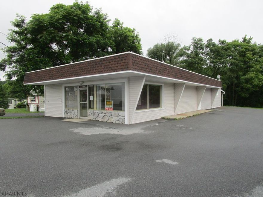 Terrific business location with excellent visibility and exposure!!!  Professional office building containing approximately 1,980 square feet. Large, open office area, two private offices, conference room, 1/2 bath and storage area. 200-ampere electric, heat pump, city water and city sewer.  The interior of this building was just remodeled and updated!