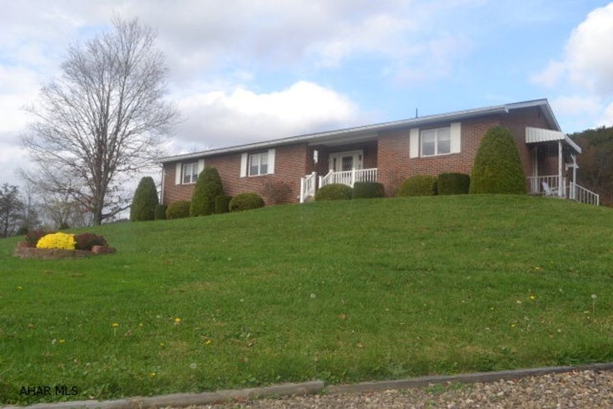 One story living with a 10+ acre back yard!  This home boasts a spacious kitchen, which invites coffee conversation!  Diningroom sets the stage for that special family dinner.  Enjoy snuggling up to the fireplace during those winter storms or Holiday celebrations.  Living room extends family space with swirled ceilings.  Foyer is perfect entry to your home with 2 closets.  Full basement with walk out, partially finished.  Great view- see pictures!