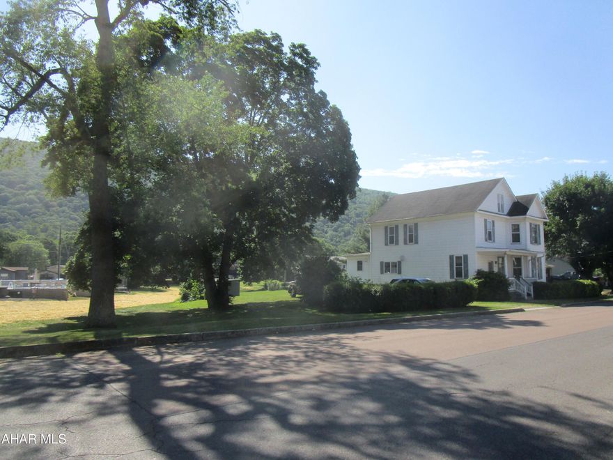Original farm in Hyndman Borough. A good street-appeal prop. along Cunningham Dr.  Spacious home in need of some ''TLC''.  Updated kitchen cabinets. 1st flr. combo laund. & 3/4 bath + 2nd floor bath. Total house fan.  A 1-car int. garage. Porches.  Stg. shed.  West Penn Electric. 
Current 5/23/24 fees: Hyndman Boro sewer ($47/mo.); Hyndman Boro. water ($25/mo.); Hyndman Boro garbage ($22.04/mo.)-call 842-3191 or 842-9392. 
 Portion of back yard may be in a FEMA Special Flood Hazard Area; the home does not appear to be in; however, NO warranty is implied. Buyers to confirm taxes; gross living area; exact boundary lines, if so desired; &, the FEMA Special Flood Hazard Area delineation.