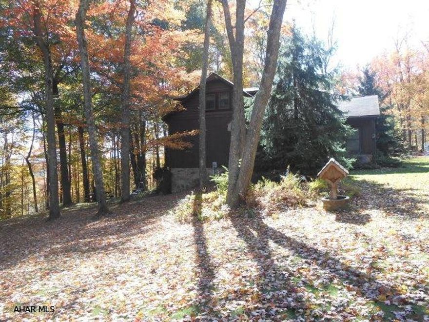 Quality and unique country  home perfectly nestled into beautiful natural landscaping with heated garage-hot tub plus garage. Offering a screened in deck for  quiet time or family gatherings.Flat yard with many options for outside sports,gardening and entertainment.Courtyard with soothing water fountain is inviting for entertaining and is waiting for your personal touch! Enjoy the acreage for horse back riding/hunting and off road vehicles.Horse riding trails are within a mile.State Forest lands are also close by.Enjoy the open space inside this warm and inviting home that offers new wood floors through out,unique lighting fixtures,living room offers a great fireplace to be enjoyed,new tile floors in kitchen, many more features must see to appreciate.