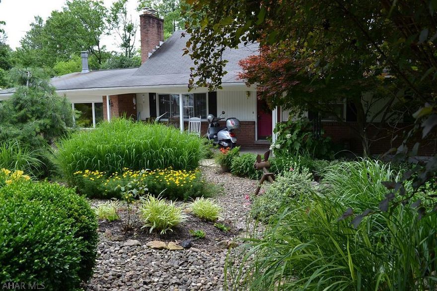 Sylvan Hills area of Hollidaysburg. This charming 4 bedrooms features a large MBR suite on first level with updated bath. The gourmet kitchen is total update and features Thermodore heat lamps. The large family room off the kitchen keeps everyone toasty with custom wood stove. The front entrance features KOI pond and the gardens are throughout the property.