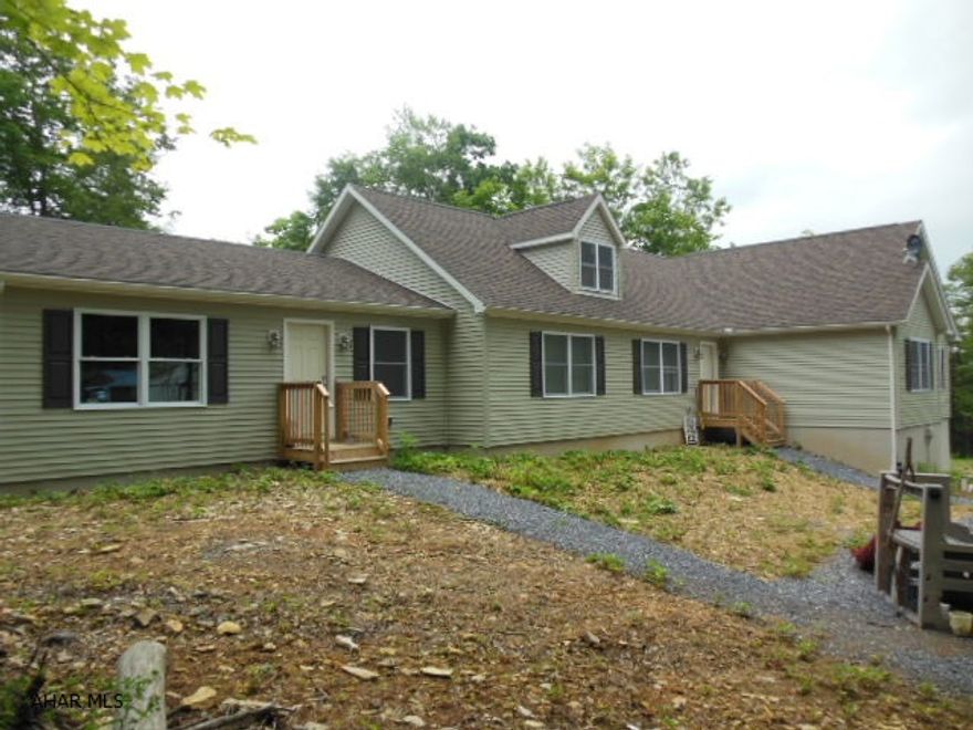 Reduced! Motivated!  Don't miss this chance to own your own beautiful property 10 mins from Altoona and only 35 minutes from State College!  Two miles from Bellwood Antis School.  Close to city living but set in a rural scene.  Large, beautiful new home sitting on 29 acres of wooded ground with winding stream running through it.  Absolutely perfect haven for the hunter or fisherman in your family.  This ranch home boasts a large 40x12 composite deck overlooking the ground and has a unfinished full basement with an integral one bay garage.  Large bedrooms with a master suite with a soaking tub and separate shower.  Also a separate mother-in-law suite with its very own private entrance and sliding glass door that leads to the back deck.  A brand new kitchen with s/s appliances & MORE!