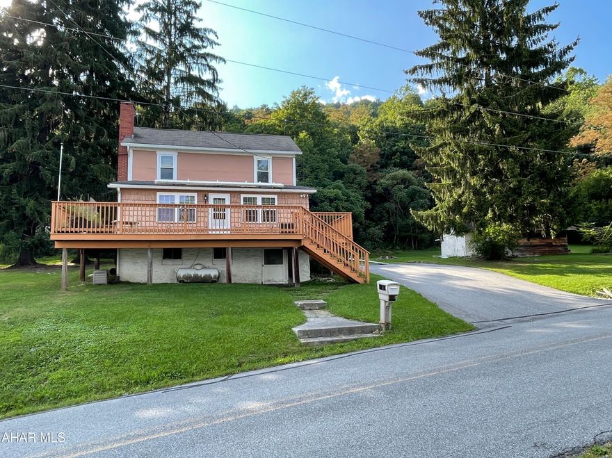 Here's the home out in the country you've been waiting for! This move-in ready two story home sits on over 7 acres and holds 3 bedrooms and 2 bathrooms, along with a large barn right across the road and 2 other out buildings. Sit on the large deck on the front of the house and enjoy the country views. Located less than 10 miles from the beautiful Indian Lake and Shawnee State Park. List of upgrades done by the seller available. Selling as-is.