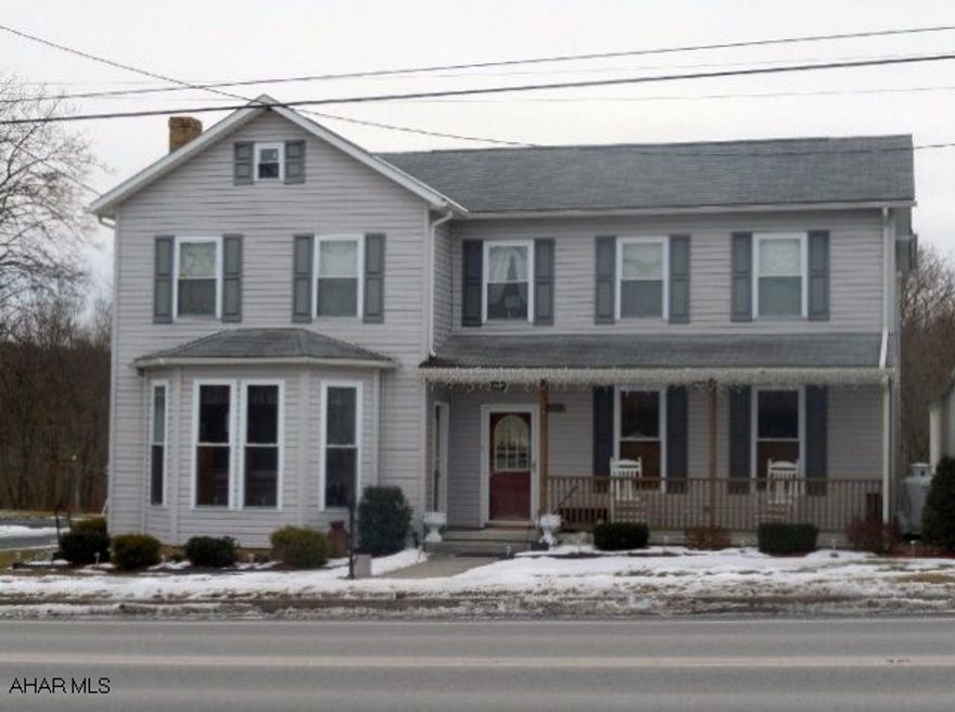 This lovingly maintained and improved 4-5 bedroom 2 bath two story was seen in Christmas tour 2010 and boasts 3900 sq, ft.! Possible one floor living, spacious open Family Room off kitchen area, 34x30 covered deck connects house to detached, oversize 2-car heated garage with 1073 sq. ft. apartment. One bedroom apartment w/large bath, living area w/wet bar. Flagstone patio adjacent to 1800's district judges office. Terrific value - tons of room - and a complete refurbishing by present owner. Close to Shawnee State Park.