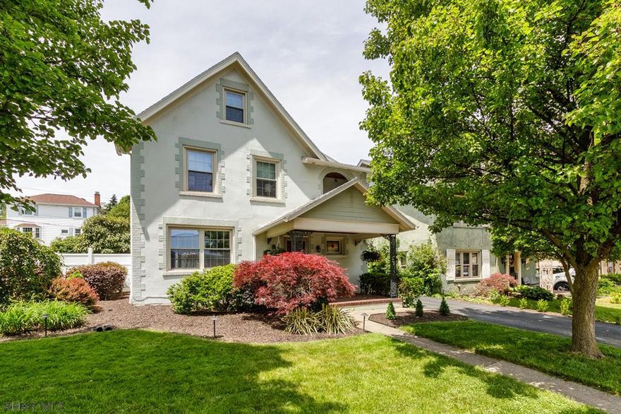 Fenced in corner lot! Beautiful hardwood floors throughout, ceramic tile and cherry cabinets and pantry in kitchen, built in shelves and gas fireplace in living room, 3 spacious bedrooms and spacious full bath 2nd floor. Balcony off main bedroom, walk up attic, refinished covered patio in back and newly installed fence for privacy, 2 car garage with private driveway. Tax ID# - 01.12-22.-020.00 & 01.12-22..