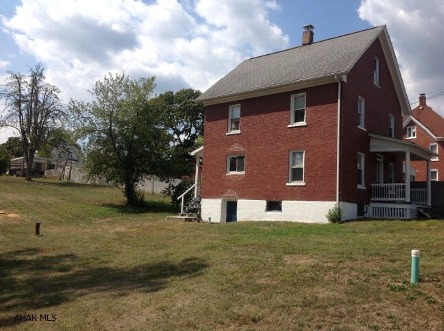 Nice brick two story home with great corner lot and detached garage very spacious yard.