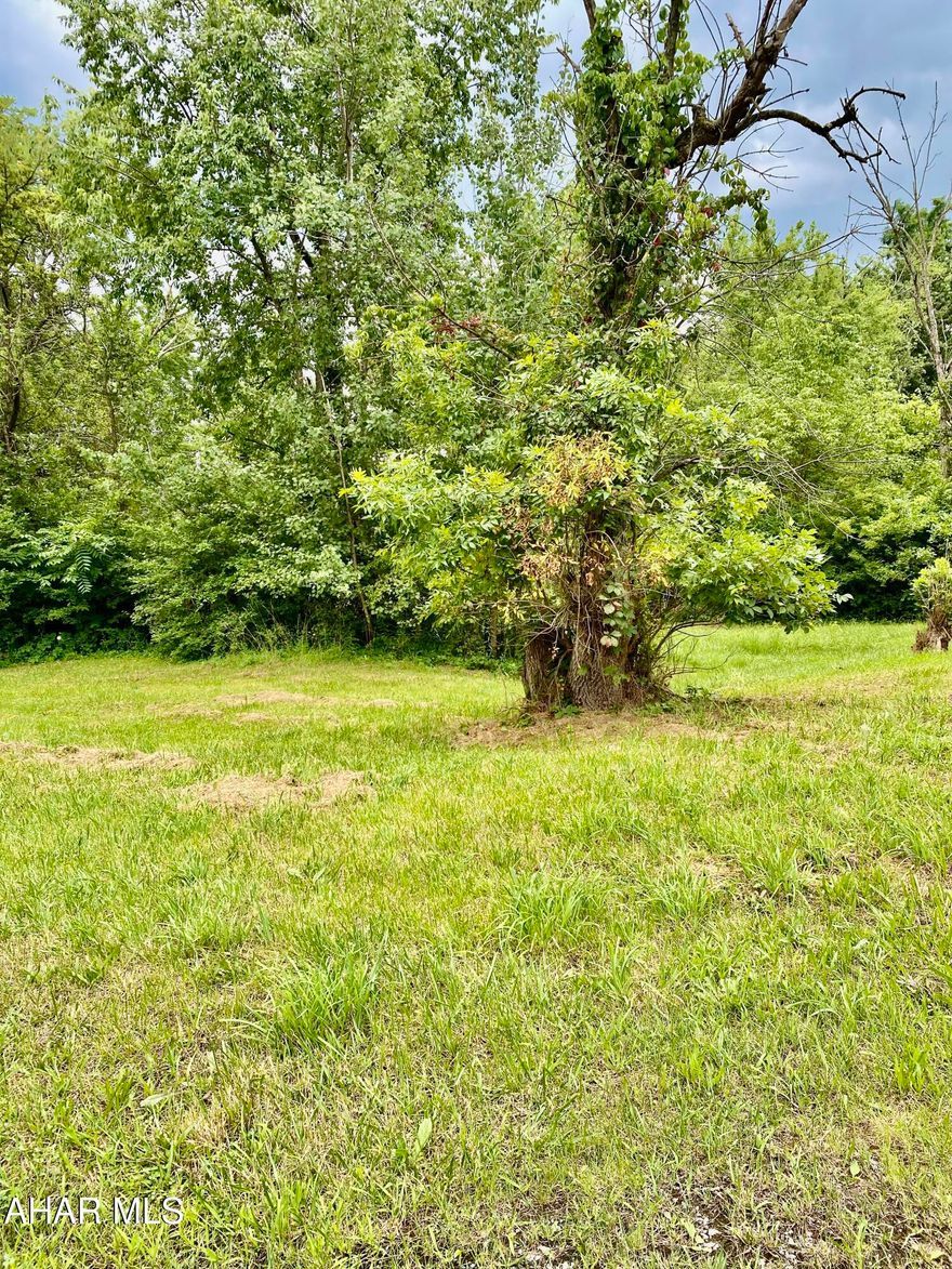 Buildable 0.33 Acre Lot - Utilities Available!!

Opportunity awaits with this partially wooded parcel located on N 6th Ave in Altoona. Offering 0.33 acres, on 2 double lots, with city water, sewer, and electric available,  this lot is ideal for a single-family home or small multi-unit build. Enjoy privacy with mature trees while being just minutes from local amenities and schools. Buyer responsible for utility connections. Mixed use zoning Residential/Commercial. Drive by and envision your next project today!