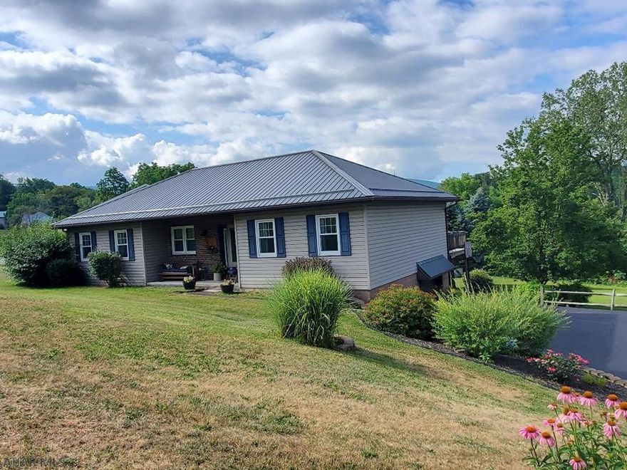Beautifully renovated ranch home in Bellwood Antis SD. Spacious lot, 0.56 ac. New metal roof, windows, updated mechanics, new bathroom w/walk in shower, finished basement w/gas FP, 2018 renovations include new appliances, flooring, laundry nook, quartz countertops and new CA in 2022.