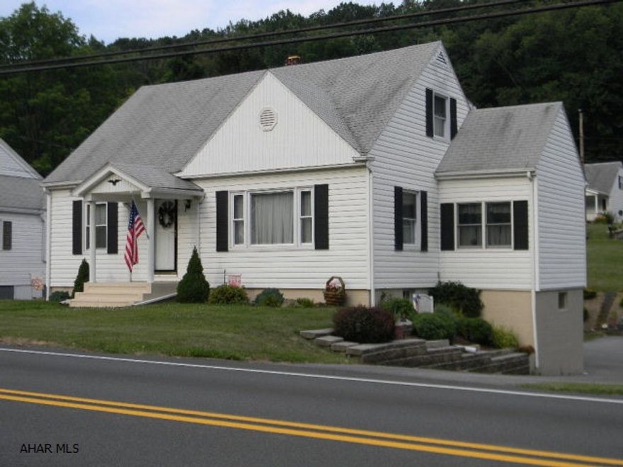 Immaculate vinyl 4BR/2BA Cape Cod on beautifully landscaped lot outside of town with full partially finished walk-out basement and oversized integral garage. This ready-to-move-in home's most recent improvement are numerous: Dining room addition, up-dated kitchen, vinyl siding and windows, covered patio, Burnham HW furnace and water heater. Immediately available. Please call for an appointment now.