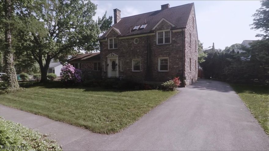 Welcome to one of the classic beauties on Mansion Blvd in Altoona.  This 1939 beauty is a unique natural river stone home on one of the largest lots in Mansion Park ..  The rooms in this home are HUGE - with many crystal chandeliers!  Foyer opens up to an open winding stairway leading to 2nd floor.  Master bedroom has a cedar lined walk-in closet with plenty of shelving that rivals it in size.  A large newer addition built to match the original home has a river stone fireplace, wet bar, and  built in bookshelves, plus a half bath.  Take a step back in time and imagine yourself in Tuscany - this property even has grape arbors and a stone courtyard.    Three fireplaces too.  Plenty of off street parking.